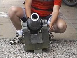 Luke tries one of the small canons at the Carbisdale Castle main entrance